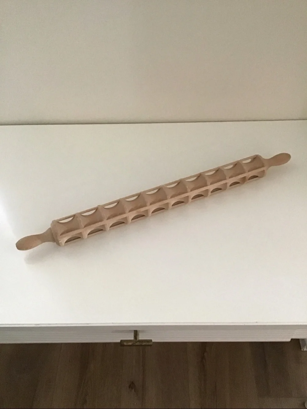 Traditional wooden ravioli rolling pin